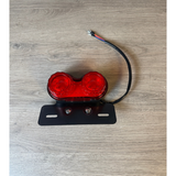 Universal 12-volt tail light with built-in indicators—new but without packaging
